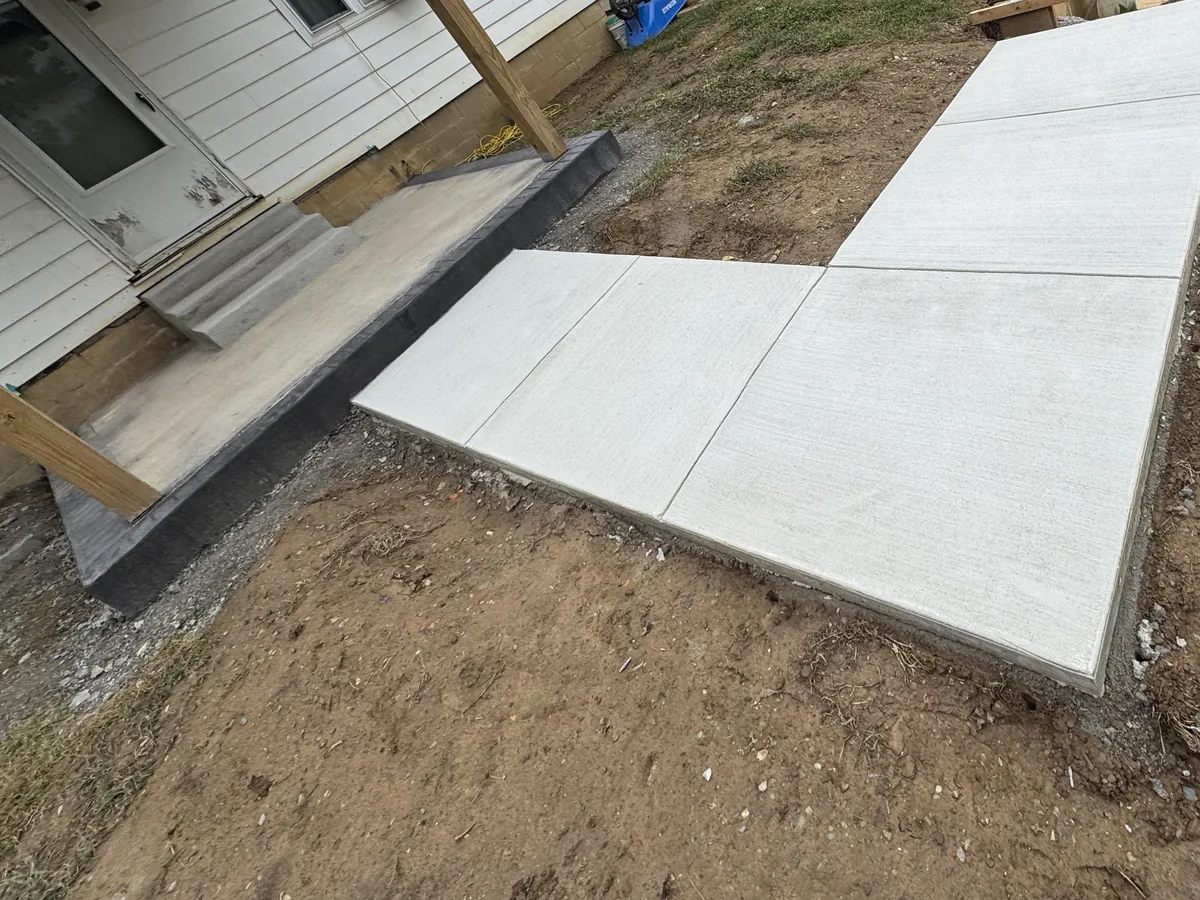 New concrete walkway, steps and charcoal stamped border poured by TH Concrete in Portsmouth, Ohio
