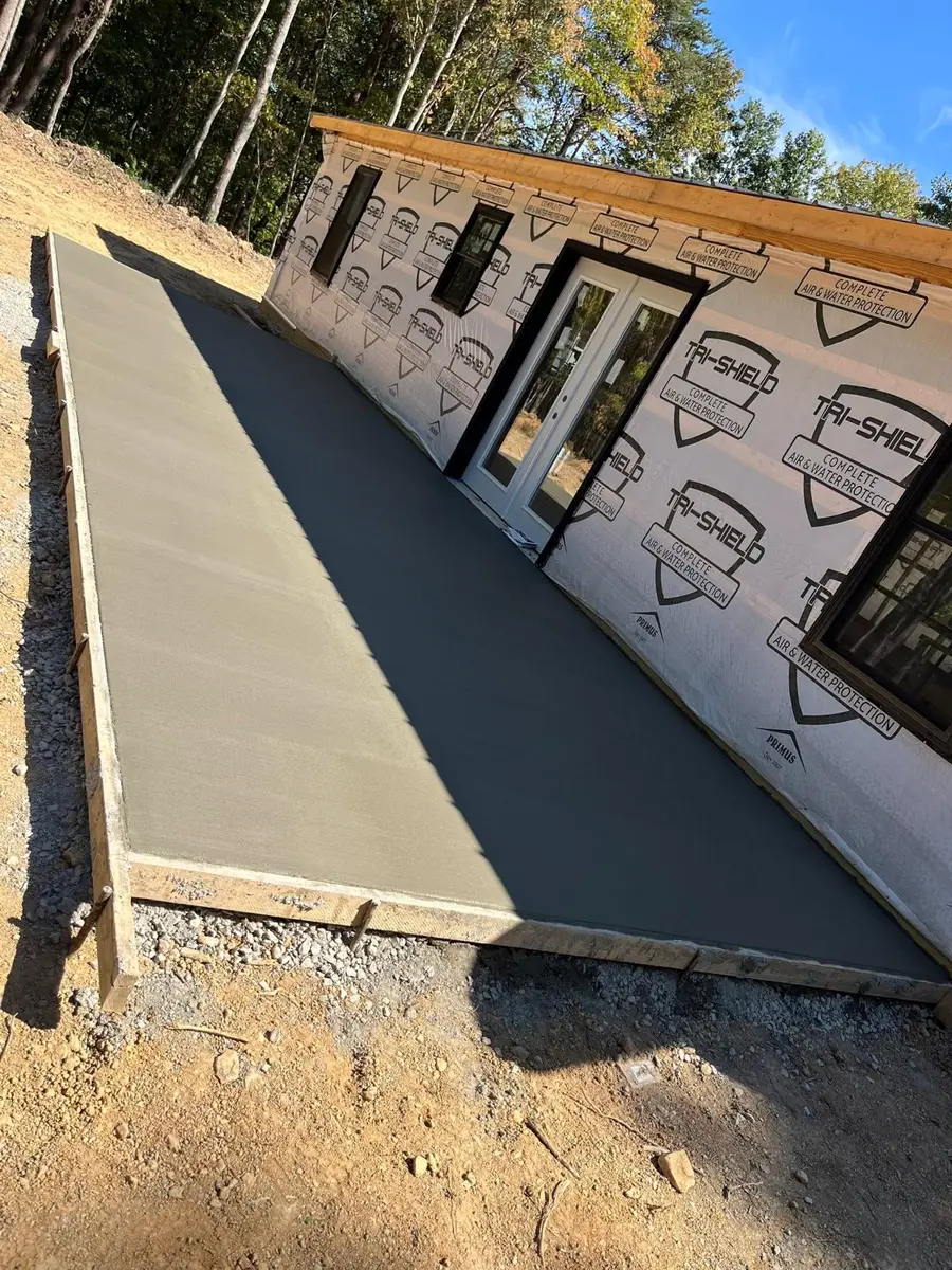 Large fresh slab beside a new build